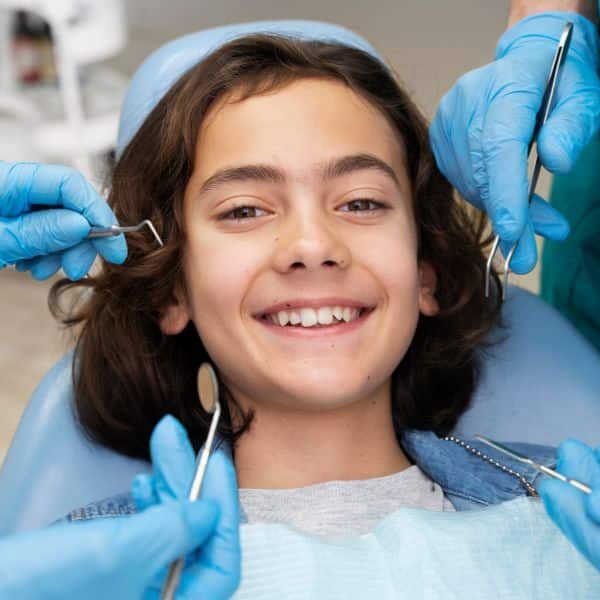 White fillings for kids — Dr. Sharma restoring tooth at Smiles for Kids Peachtree Corners GA