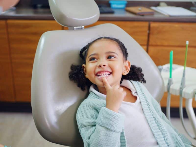 Happy child smiling at Smiles for Kids pediatric dentist and orthodontics office in Cumming GA